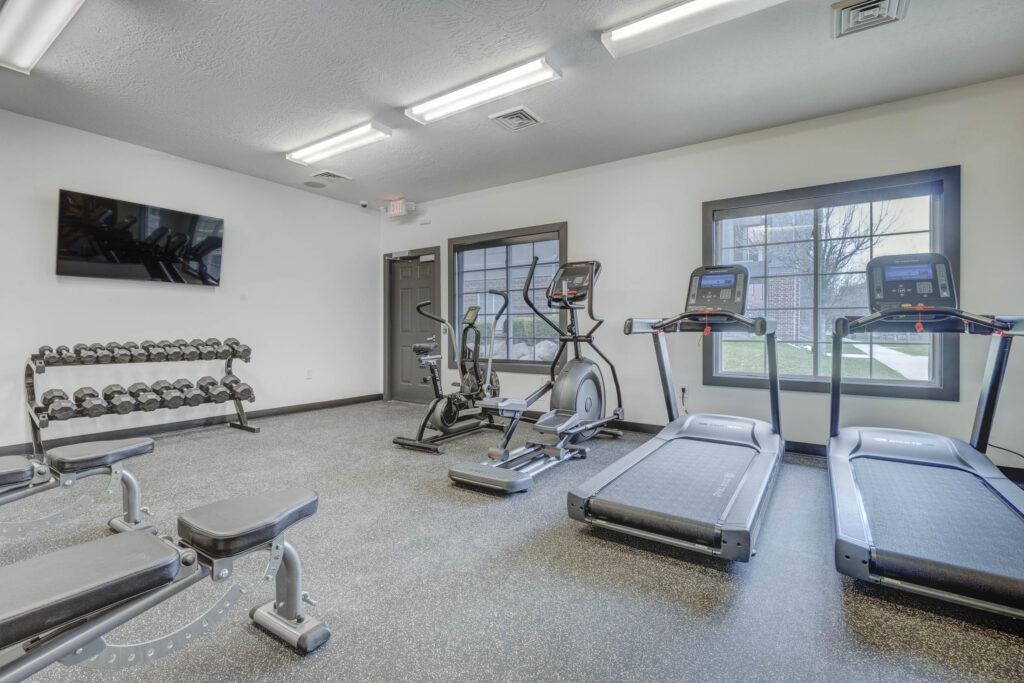 Fitness center with cardio machines and free weights