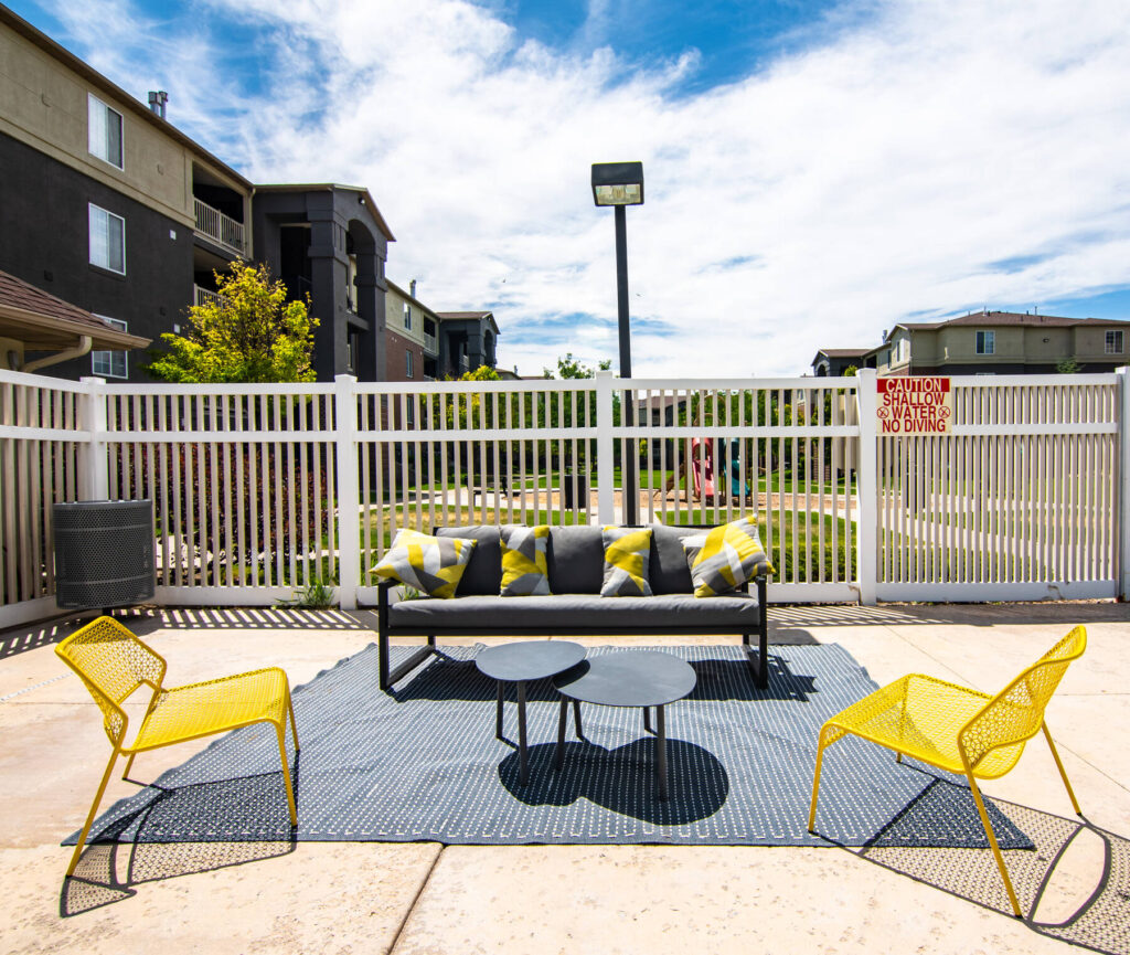 outdoor sofa and chairs by the pool