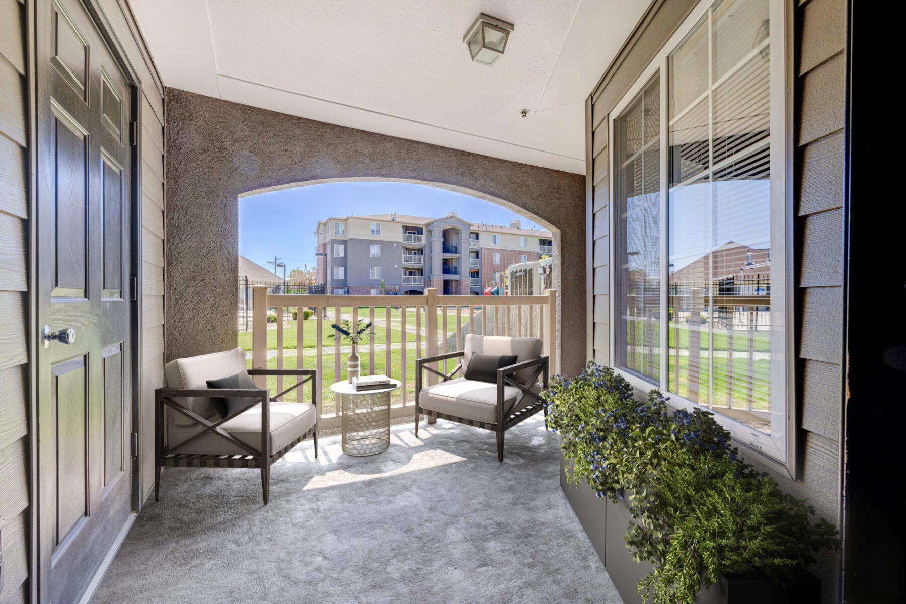 Balcony with two chairs at Park Vue low-income apartments in SLC